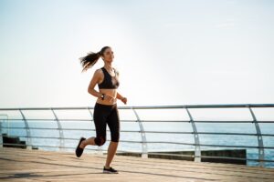 Woman jogging outdoors demonstrating improved activity levels during Tesofensine weight loss therapy