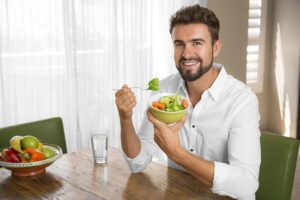 Patient eating a healthy meal and practicing proper hydration during weight loss treatment