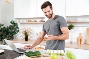 Man preparing a healthy meal to support nutrition and hydration during testosterone replacement therapy