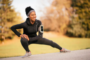Woman exercising outdoors while progressing through a structured weight loss therapy program