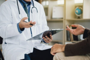 Healthcare provider discussing symptoms and follow-up care related to testosterone replacement therapy